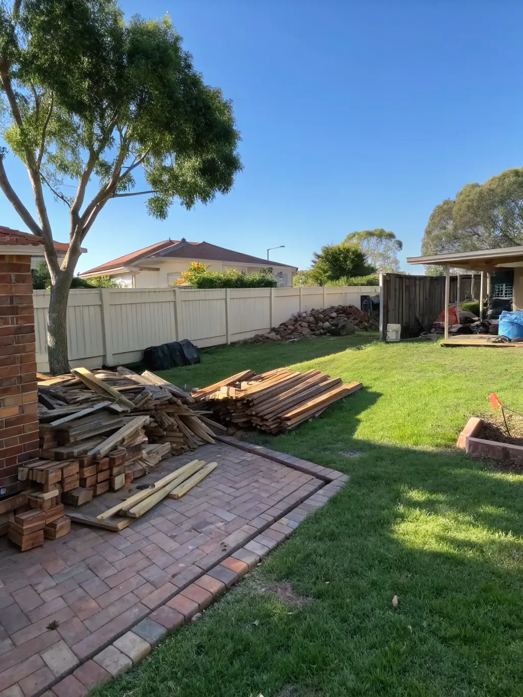 A photograph of a residential neighborhood in Conroe, TX, with a focus on a clean and well-maintained property after a junk removal service.